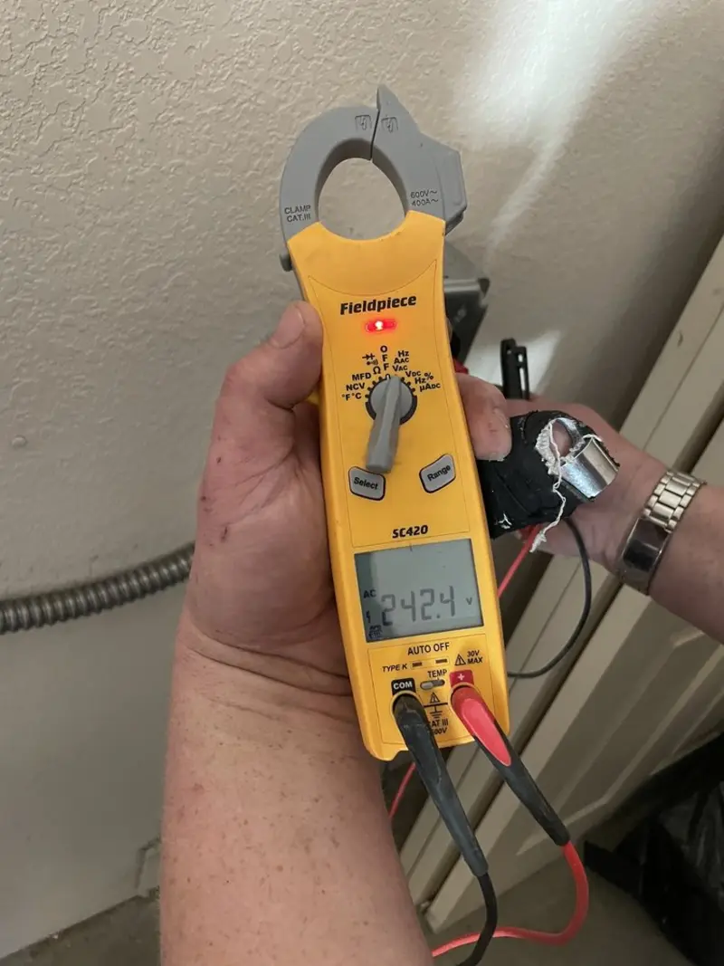 Voltage testing with clamp meter during Whole House Surge Protector in Kill Devil Hills